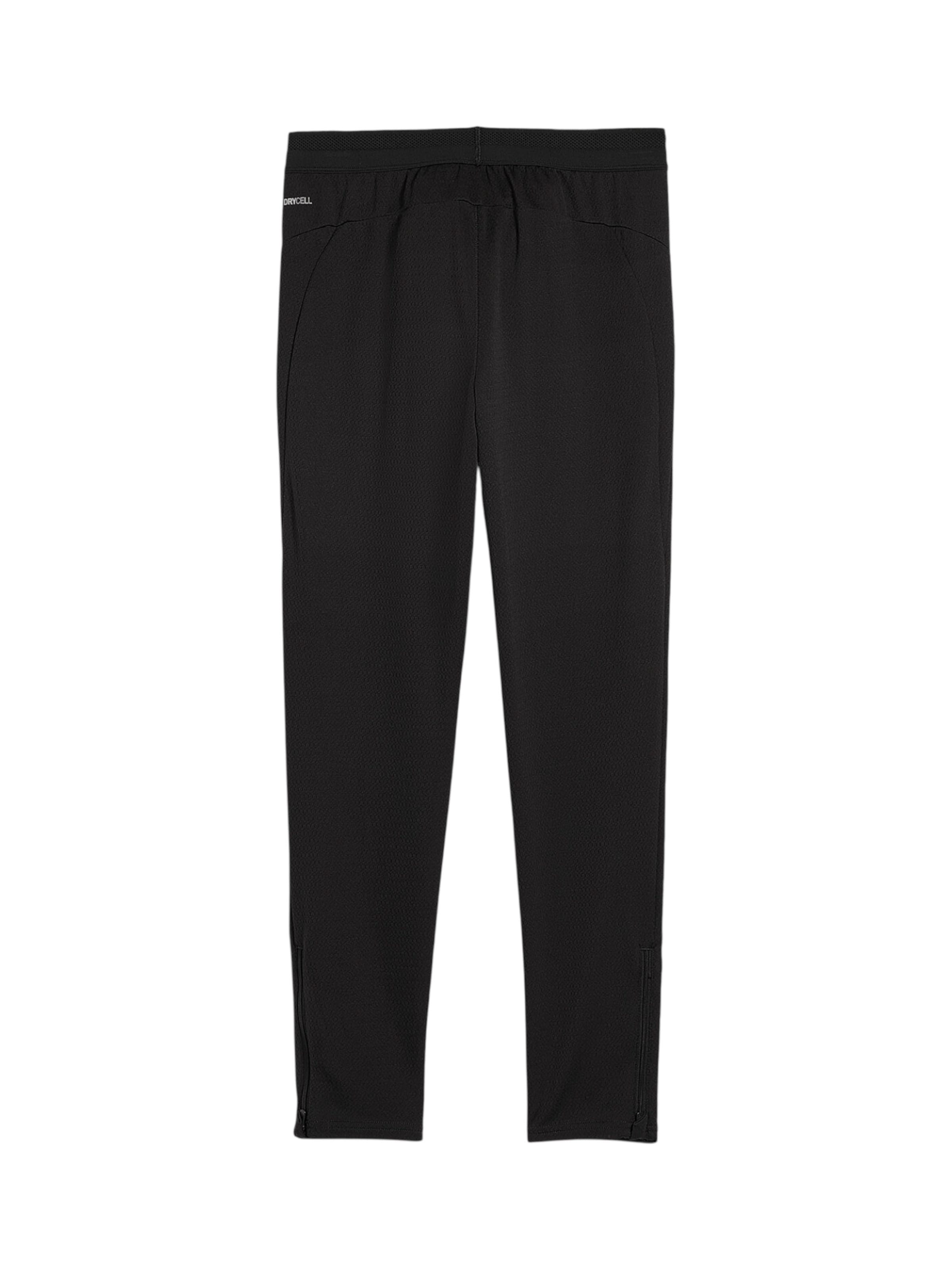 PUMA Tapered Urheiluhousut 'Manchester City' värissä musta