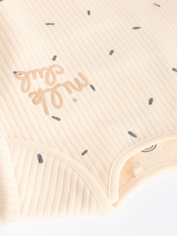 Tutina / body per bambino di Next in beige