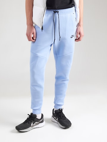 Tapered Pantaloni di Nike Sportswear in blu: frontale