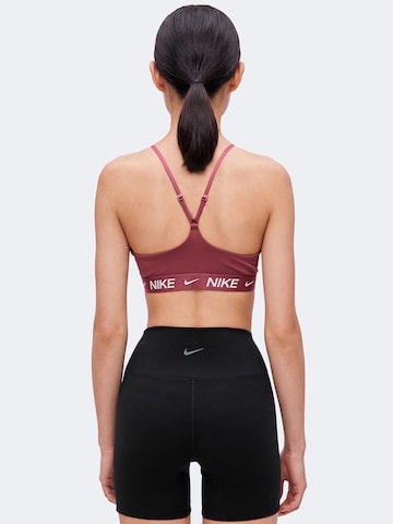 NIKE Bygelfri Sportbehå 'INDY' i rosa