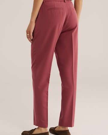 Slimfit Pantaloni con piega frontale di WE Fashion in rosa