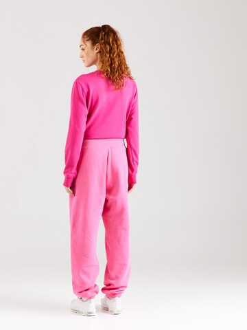 Nike SportswearTapered Hlače 'PHOENIX FLEECE' - roza boja