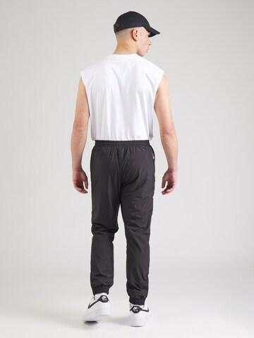 Tapered Pantaloni di Karl Kani in nero