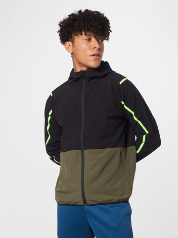 PUMA Athletic Jacket in Green: front