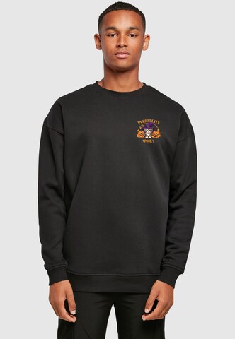 Merchcode Sweatshirt 'Halloween - Purrfectly Spooky Cat' in Schwarz: Vorderseite
