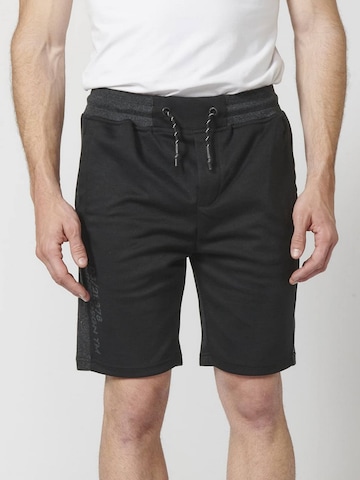 KOROSHI Regular Trousers in Black: front