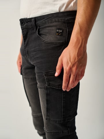 KOROSHI - Skinny Pantalón vaquero cargo en negro