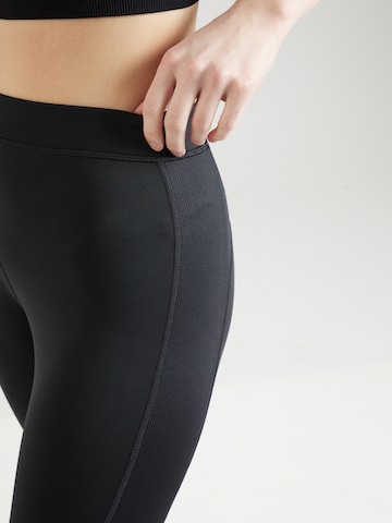 Reebok Skinny Športne hlače 'Vector' | črna barva