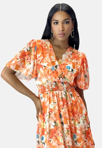 Elara Kjole i orange