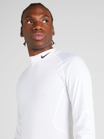 T-Shirt fonctionnel 'Mock' NIKE en blanc