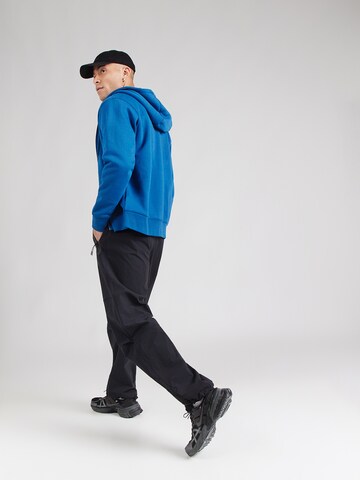 Nike Sportswear Ohlapna forma Funkcionalne hlače 'Tech' | črna barva