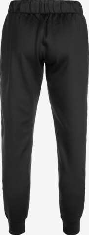 UNDER ARMOUR Tapered Workout Pants in Black: front