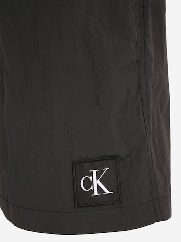 Calvin Klein Swimwear Plavecké šortky – černá
