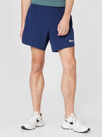 Regular Pantalon de sport 'SLAM' NIKE en bleu : devant