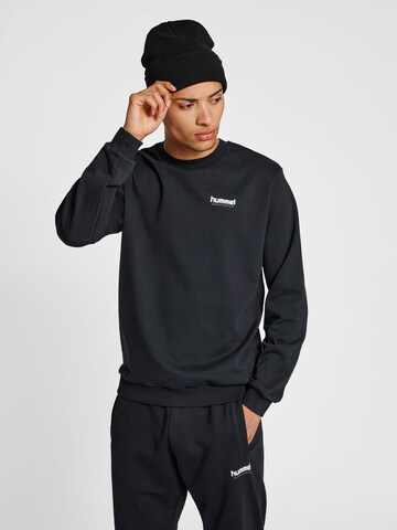 Hummel Sportsweatshirt 'Austin' in Zwart: voorkant