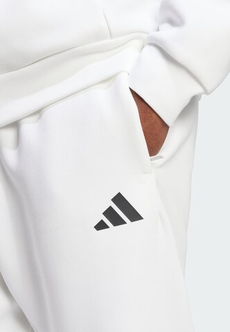 ADIDAS SPORTSWEAR Tapered Sports trousers 'Future Icons' in White