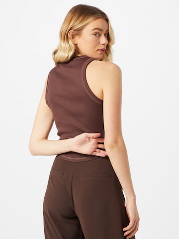 NU-IN Top 'Genesis' in Brown