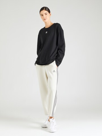 ADIDAS SPORTSWEAR Lużny krój Spodnie sportowe 'Essentials' w kolorze beżowy