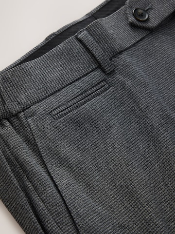 Slimfit Pantaloni con piega frontale di Next in blu