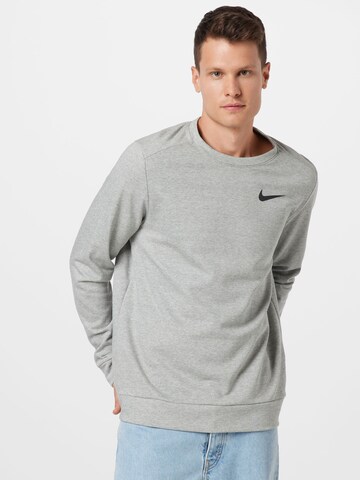 NIKE - Camiseta deportiva en gris: frente