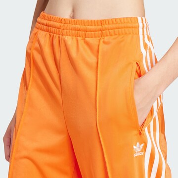 ADIDAS ORIGINALS Wide leg Pants 'Firebird' in Orange