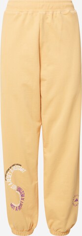 ADIDAS BY STELLA MCCARTNEY - Loosefit Pantalón deportivo en amarillo: frente