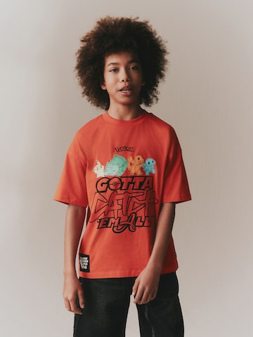 Next T-shirt i röd: framsida