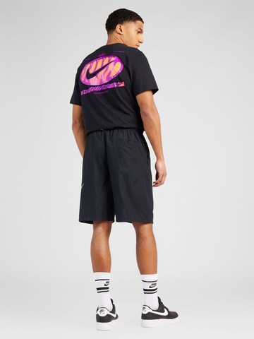 Nike Sportswear Loosefit Housut 'CLUB' värissä musta