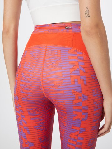 NIKE Skinny Sportbroek 'Epic Fast' in Oranje