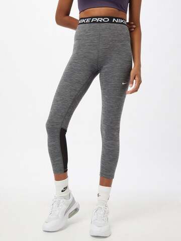 NIKE Skinny Workout Pants in Grey: front