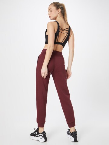 PUMA Tapered Sportbroek in Lila