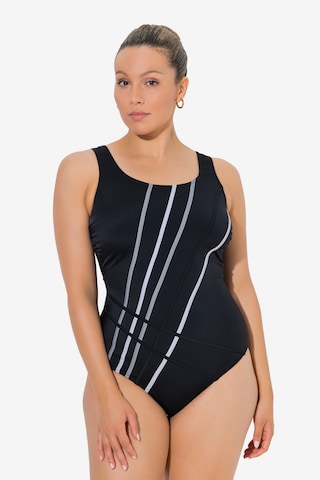 Ulla Popken Pienentävät Uimapuku värissä musta: etupuoli