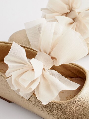 Next - Bailarina en oro
