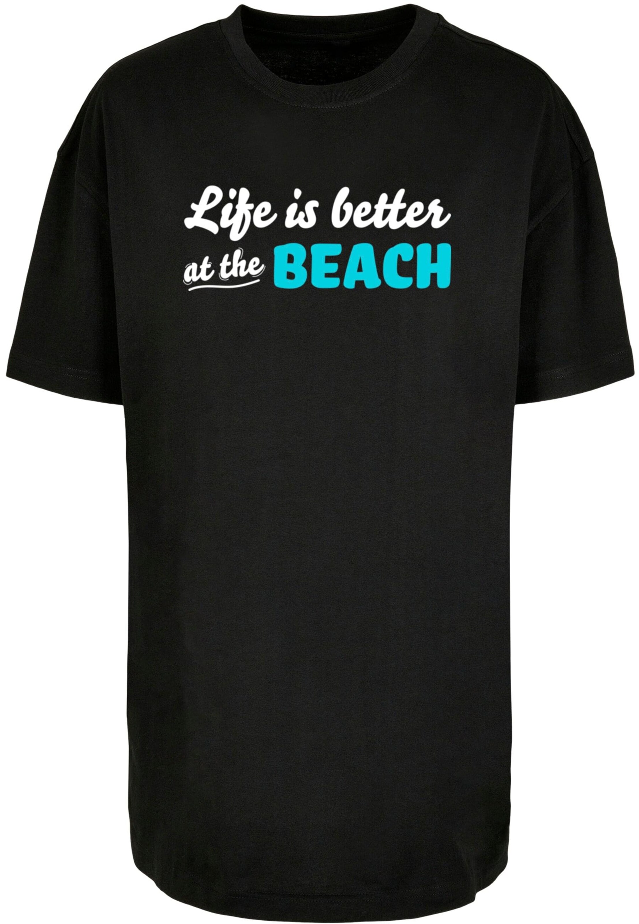 Merchcode T-Shirt 'Summer - Life Is Better At The Beach' in Schwarz: Vorderseite