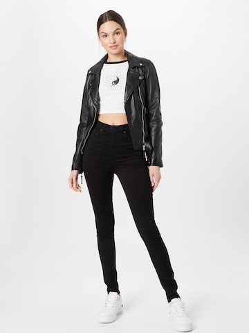 Skinny Jeans di Monki in nero