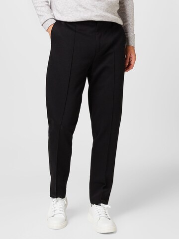 BURTON MENSWEAR LONDON Tapered Trousers in Black: front