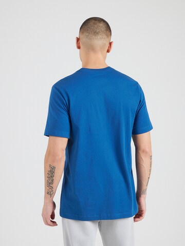 Nike Sportswear - Camiseta 'Swoosh' en azul