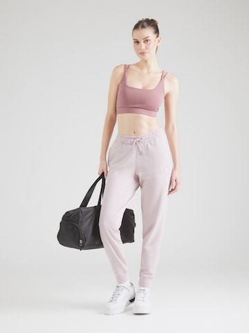 PUMA Alt kitsenev Spordipüksid 'ESS ELEVATED', värv roosa