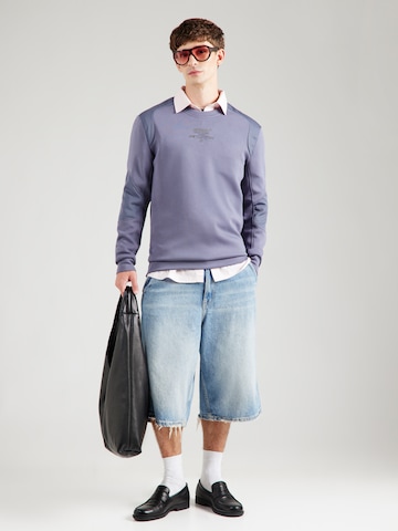 GUESS Urheilullinen collegepaita 'RYOTA' värissä sininen
