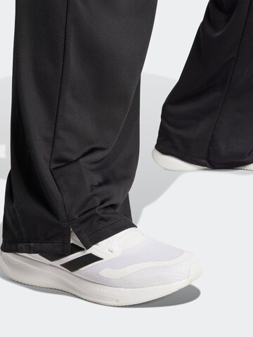 ADIDAS SPORTSWEAR Szeroka nogawka Spodnie sportowe w kolorze czarny