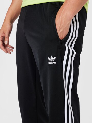 ADIDAS SPORTSWEAR Regular Urheiluhousut 'Tiro Essential' värissä musta