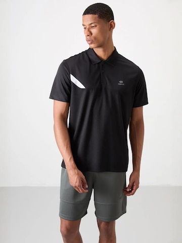 T-Shirt fonctionnel Tommy Life en noir : devant