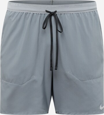 NIKE Regular Sports trousers in Grey: front