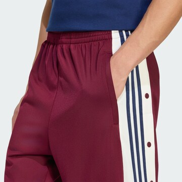 ADIDAS ORIGINALS Voľný strih Nohavice 'Adibreak' - Červená