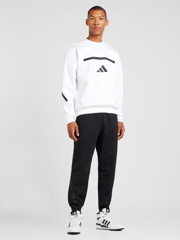 ADIDAS SPORTSWEAR Tapered Παντελόνι φόρμας 'Z.N.E.' σε μαύρο