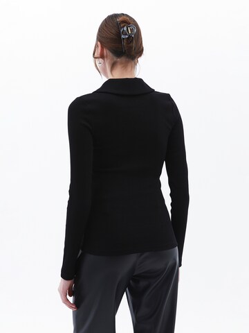 Maglietta di OXXO in nero