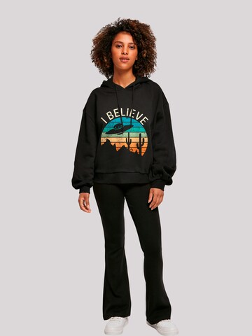 Sweat-shirt 'I Believe UFO Alien Sonnenuntergang' F4NT4STIC en noir