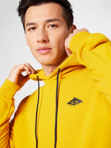 OAKLEY - Sweatshirt de desporto em amarelo