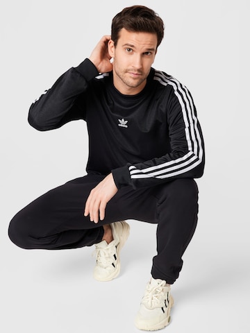 ADIDAS ORIGINALS Zwężany krój Spodnie 'R.Y.V.' w kolorze czarny