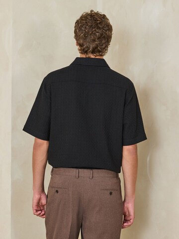 Next Poloshirt in Schwarz